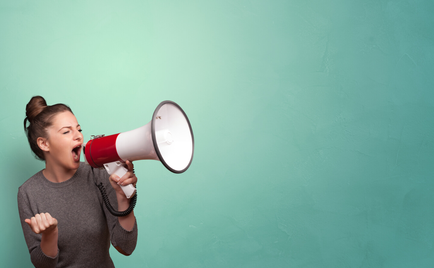 A woman using a megaphone to communicate