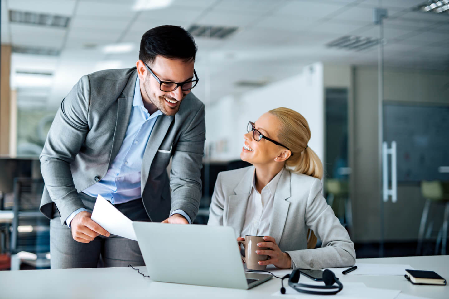 Two people are happy to see the results of their automated email campaign